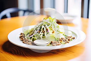 nutty cashew dressing on chicory salad, walnut crust