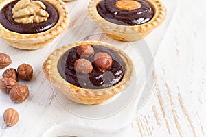 Nutty chocolate dessert small tarts closeup