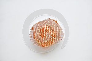 Nutty creamy round cake on a white background