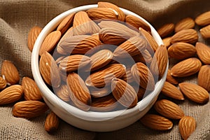 Nutty grace almonds arranged on eco canvas napkin, nature inspired aesthetics