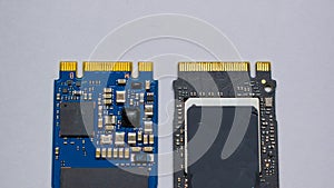 NVME M2 SSD disks for data storage at high speed closeup on isolated background. Comparision view focused at the pinpoint.