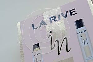 La rive IN woman deodorant and perfume bottles in brand box on beige background. LA RIVE S.A. is one of the leading producers of