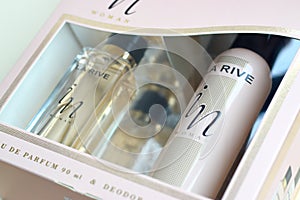 La rive IN woman deodorant and perfume bottles in brand box on beige background. LA RIVE S.A. is one of the leading producers of