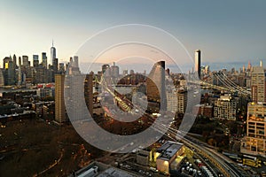 NYC from drone. Brooklyn Midtown skyline at dusk over Hudson River, NYC. Aerial Brooklyn Bridge in NYC. Top view of