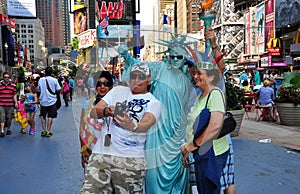 NYC: Family Posing with Statue of Liberty Mime