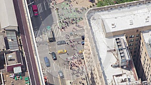 NYC Manhattan busy street traffic rooftop sun bathers 4k zoom out