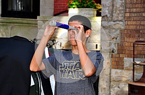 NYC: Teenaged boy with toy telescope