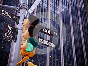 NYC Wall street yellow traffic green light black pointer guide One way to GOD. No way, no turn to devil. Right are pious efforts, photo