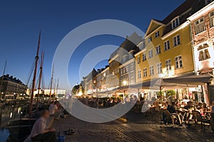 Nyhavn harbour and restaurants, Copehagen photo