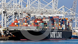 NYK LINE container ship loaded by gantry cranes in the Port of Rotterdam. The Netherlands - September 8, 2012