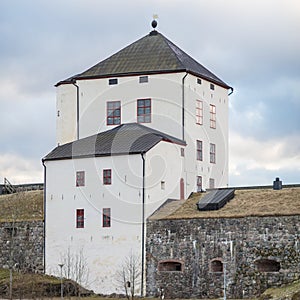 Nykopings castle in the winter with dark, cloudy sky