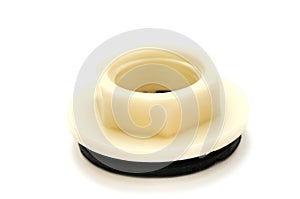 A nylon hexagonal flange nut with a black rubber seal underneath white backdrop