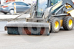 The nylon hydraulic grader brush cleans the roadway from dirt