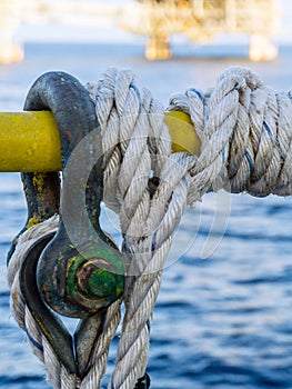 Nylon rope tied to a handrail of a construction work barge