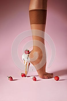 Nylons, stay-up, tights, hosiery, hose, pantyhose socks summer collection on pink background as a heel creative dessert ice cream