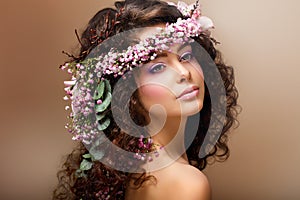 Nymph. Adorable Sensual Brunette with Garland of Flowers looks like Angel