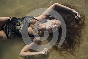 Nymph lying in water