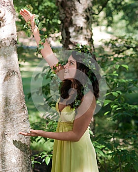 Nymph singing to a tree