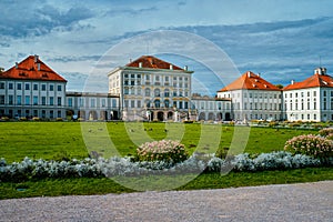 Nymphenburg palace with garden lawn in front in Munich.