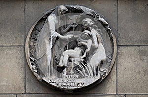 Nymphs from miraculous sources. Stone relief at the building of the Faculte de Medicine Paris