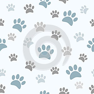 Cute boyish paw prints on seamless pattern. photo