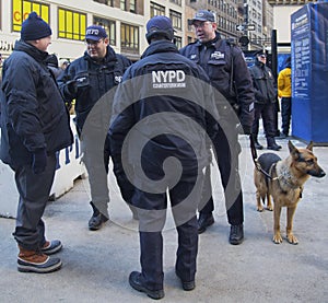 NYPD counter terrorism officers and NYPD transit bureau K-9 police officer with K-9 dog providing security on Broadway