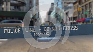 NYPD. Police line - do not cross. Blue wooden fence. New York Police Department.