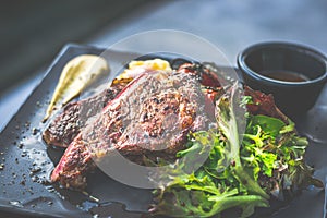 NZ ribeye steak, pan seared to medium rare, accompanied with real country creamy mashed potato, cherry tomatoes on vine, garden
