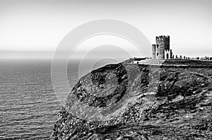O`Brien`s Tower on the Cliffs of Moher in Ireland in black and white