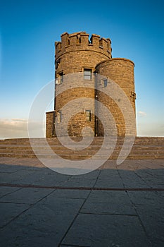 O`Briens tower at the Cliffs of Moher at sunset.