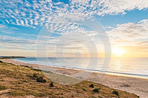 O\'Sullivan Beach shoreline with clouds over the sea during sunset