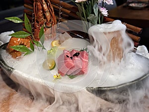 O-Toro sashimi on a dish with decoration and fog effect photo
