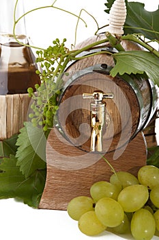 In oak casks with vines and grapes white and black