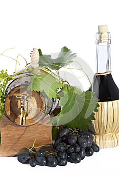 In oak casks with vines and grapes white and black