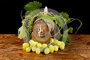 In oak casks with vines and grapes white and black