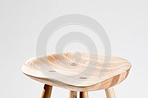 Oak chair with anatomically shaped seat on white background