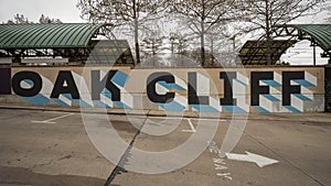 `Oak Cliff` sign on a wall at the Tyler Dart Station in Oak Cliff, Dallas, Texas.