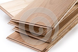 Oak engineered wood flooring boards in stack, fragment close-up