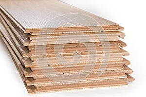 Oak engineered wood flooring boards stack, fragment of end parts