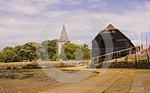 The oak timber boat house and sailing club in the historic village of Bosham in West Sussex in the South of England