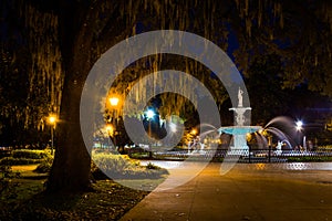 Oak tree and fountain at night in Forsyth Park, Savannah, Georgia.