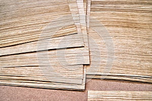 Oak veneer. Oak texture. Spliced oak veneer on the table in the workshop