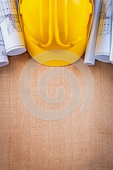 Oaken wooden board with yellow hard hat and