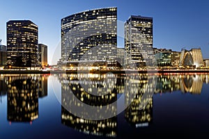 Oakland skyline panoramic view with Lake Merritt Reflections at blue hours.