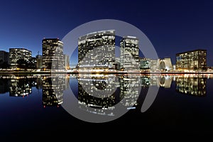 Oakland skyline panoramic view with Lake Merritt Reflections at blue hours.