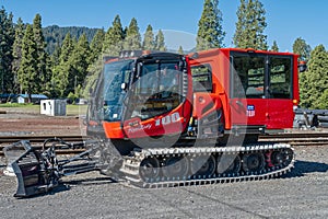 Oakridge, Oregon, USA - May 14, 2023: A Pisten Bully snow groomer parked at the Union Pacific rail yard