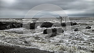 Oaraii Isosaki shrine Torii in the sea with storm Ibaraki