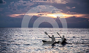 Oarsman silhouette with sunset