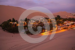 Oasis of Huacachina at night, Ica region, Peru. photo