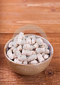 Oat bran chips close up on wooden background healthy food